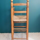 Children's high chair made of wood and straw