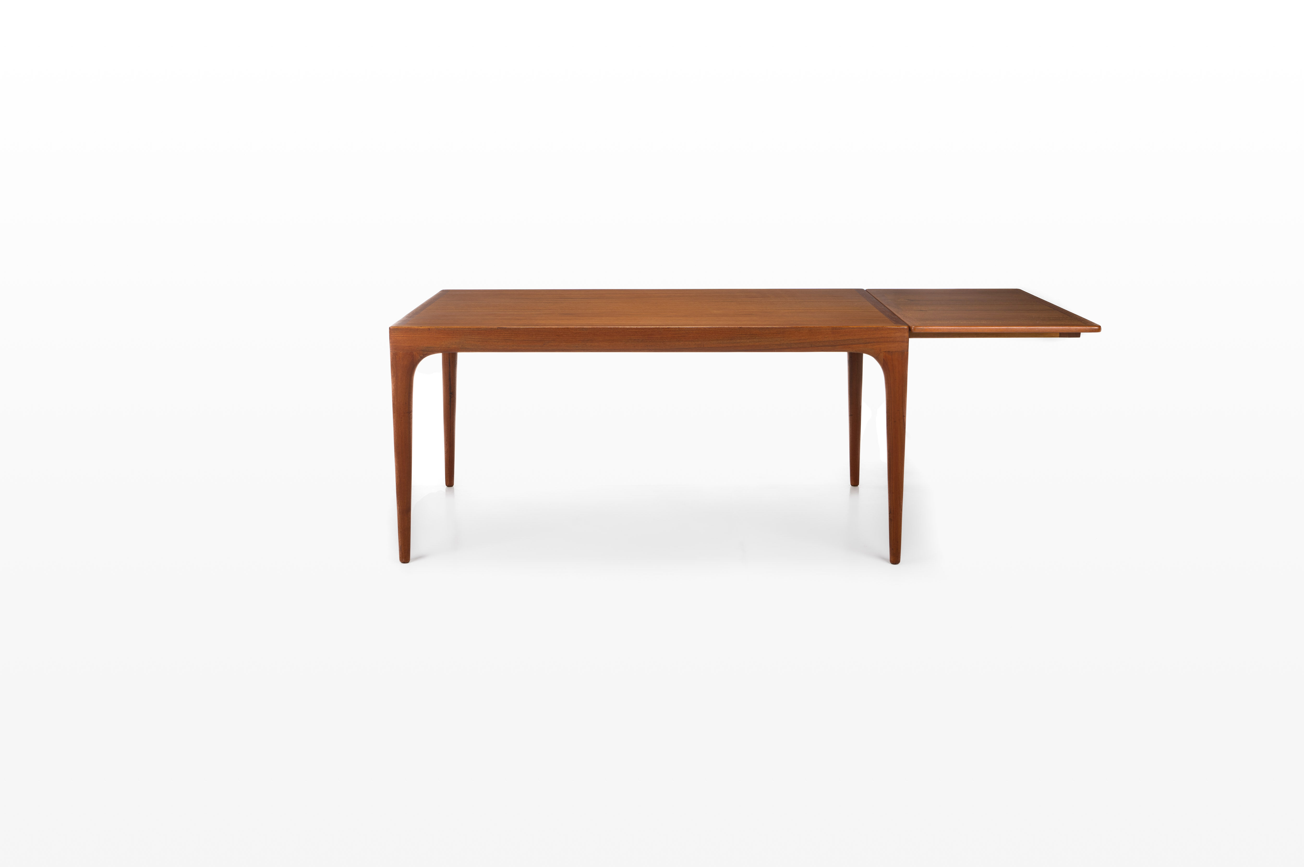 Extendable dining table in teak by Johannes Andersen for Uldum Møbelfabrik