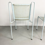 Pair of mid century perforated steel stacking chairs