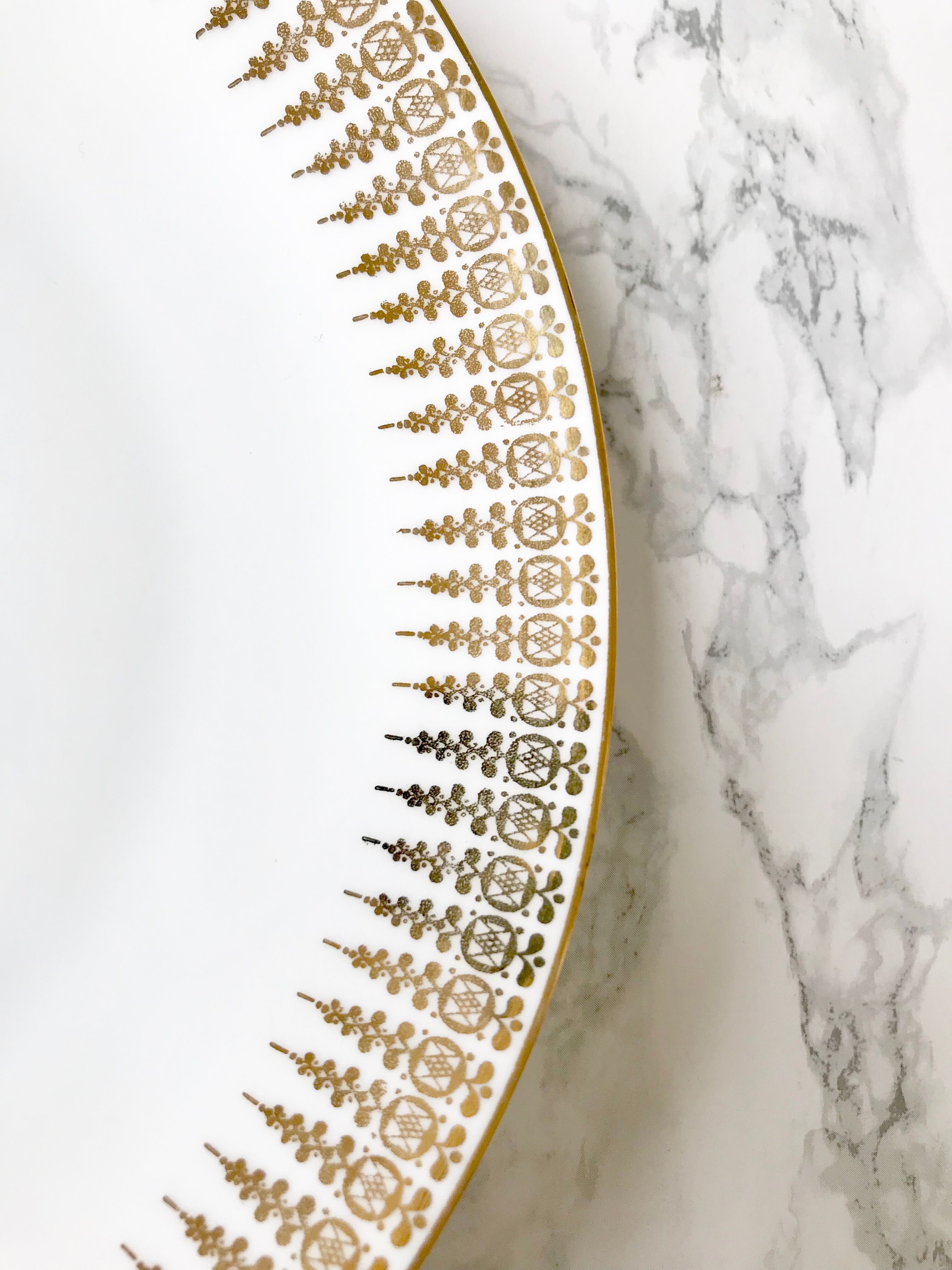 Six white and gold porcelain dessert plates