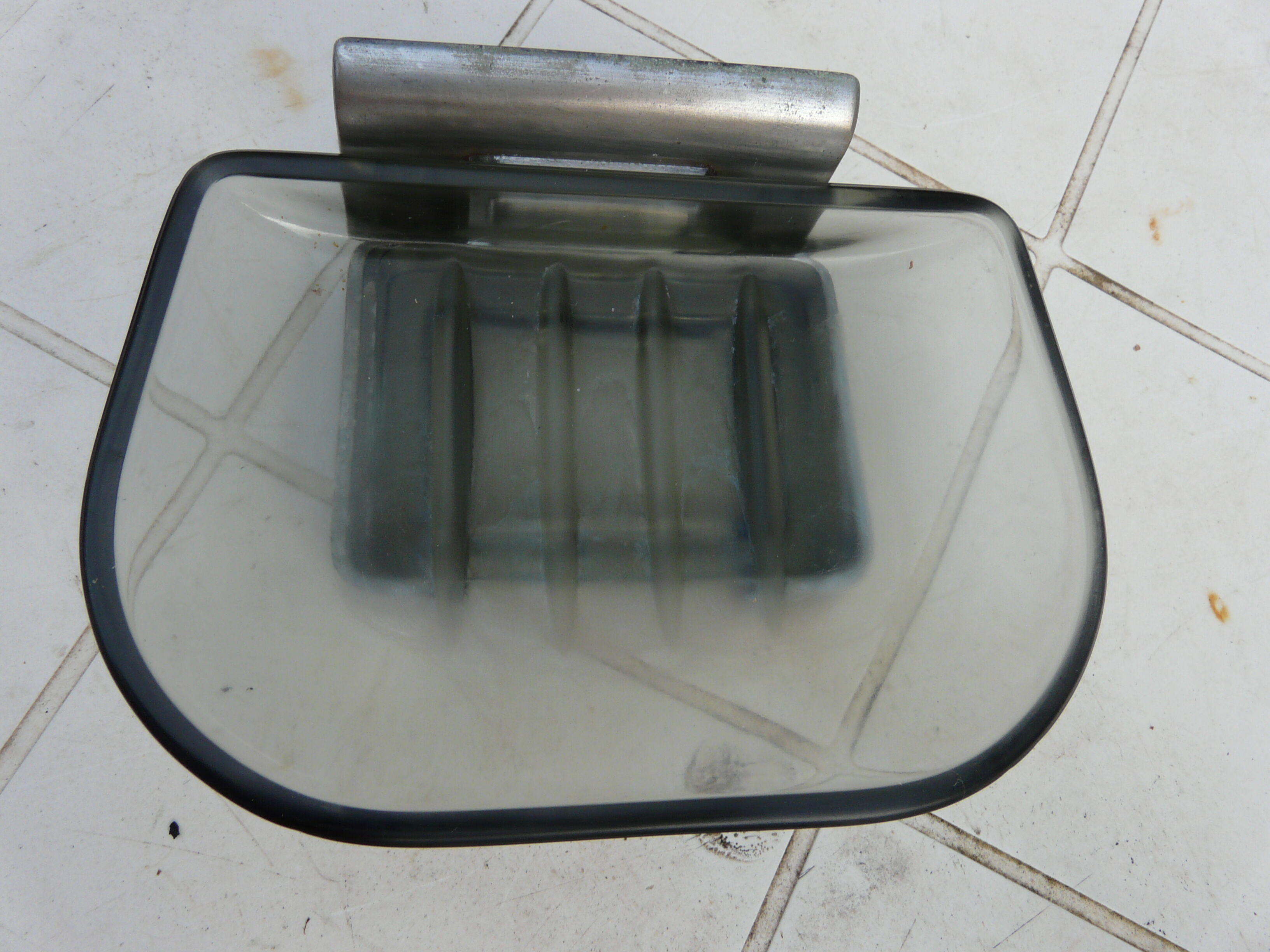 Chrome metal soap holder and smoked glass bathroom accessory