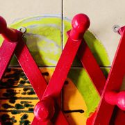 Vintage accordion coat rack in red painted wood