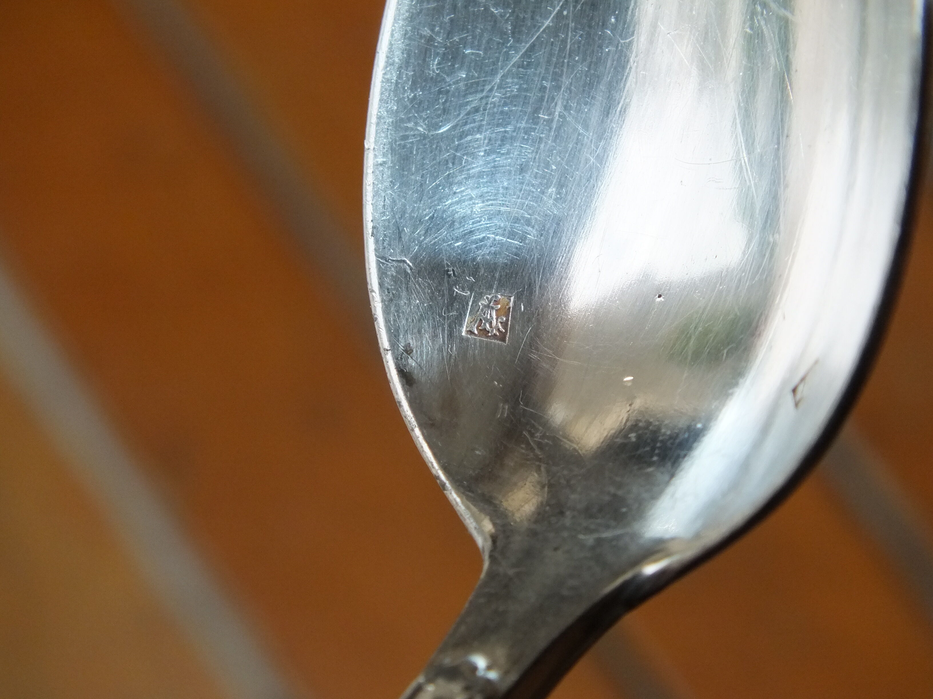 15 small silver metal spoons with rows of beads