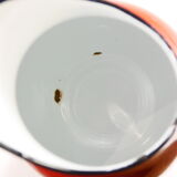 Red enameled metal pitcher