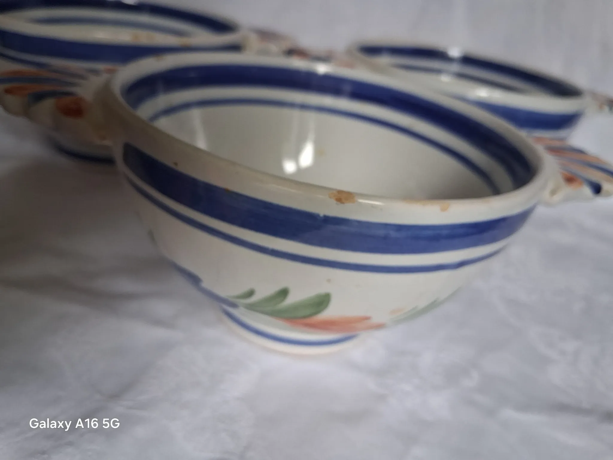 Set of three antique earthenware bowls from HB Quimper, signed.