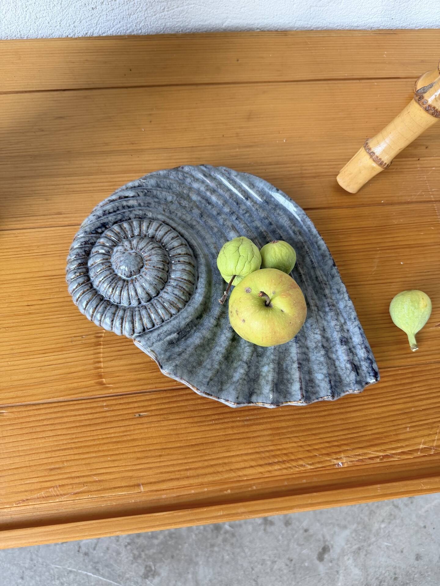 Shell-shaped ceramic catchall.