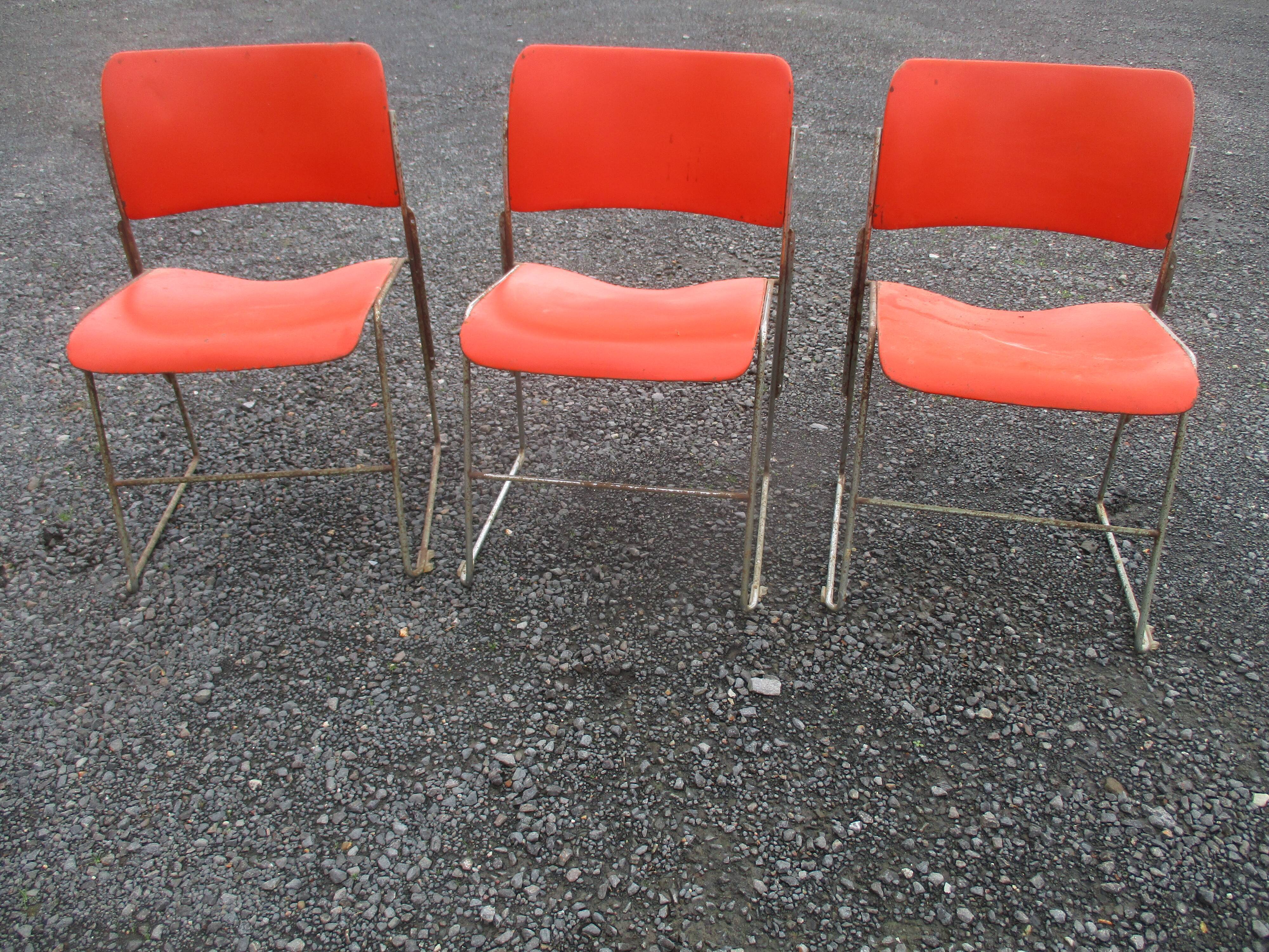 3 iron and plastic chairs
