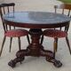 Empire guéridon in mahogany and marble, revolving top.