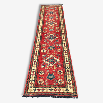 Remarkable oriental rug: former Kazak 310 x 84 cm