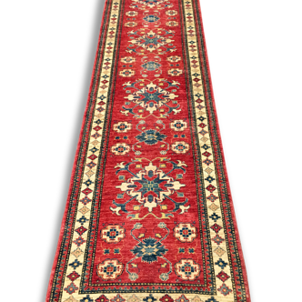 Remarkable oriental rug: former Kazak 310 x 84 cm