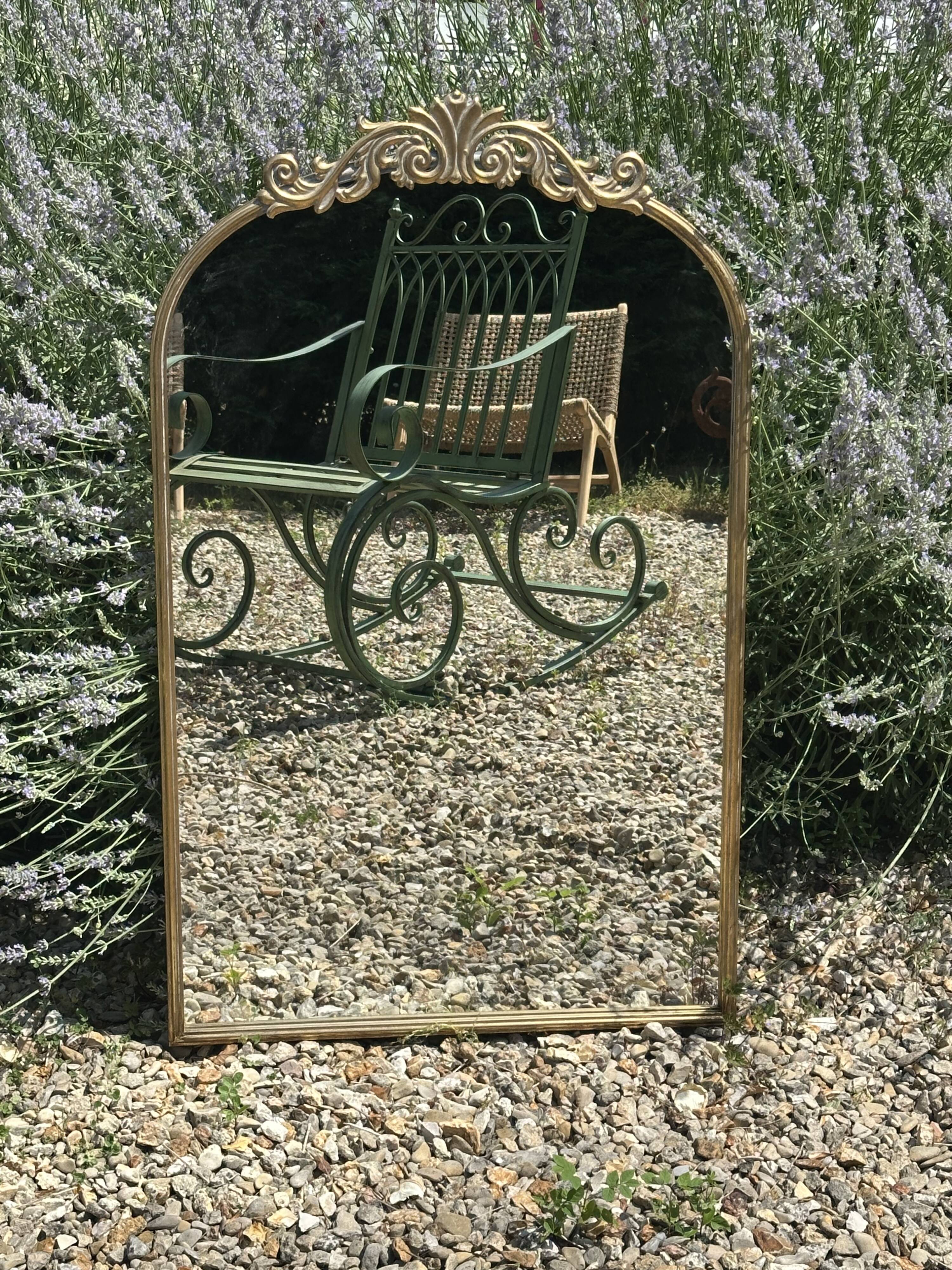 Golden metal pediment mirror from the 2000s.
