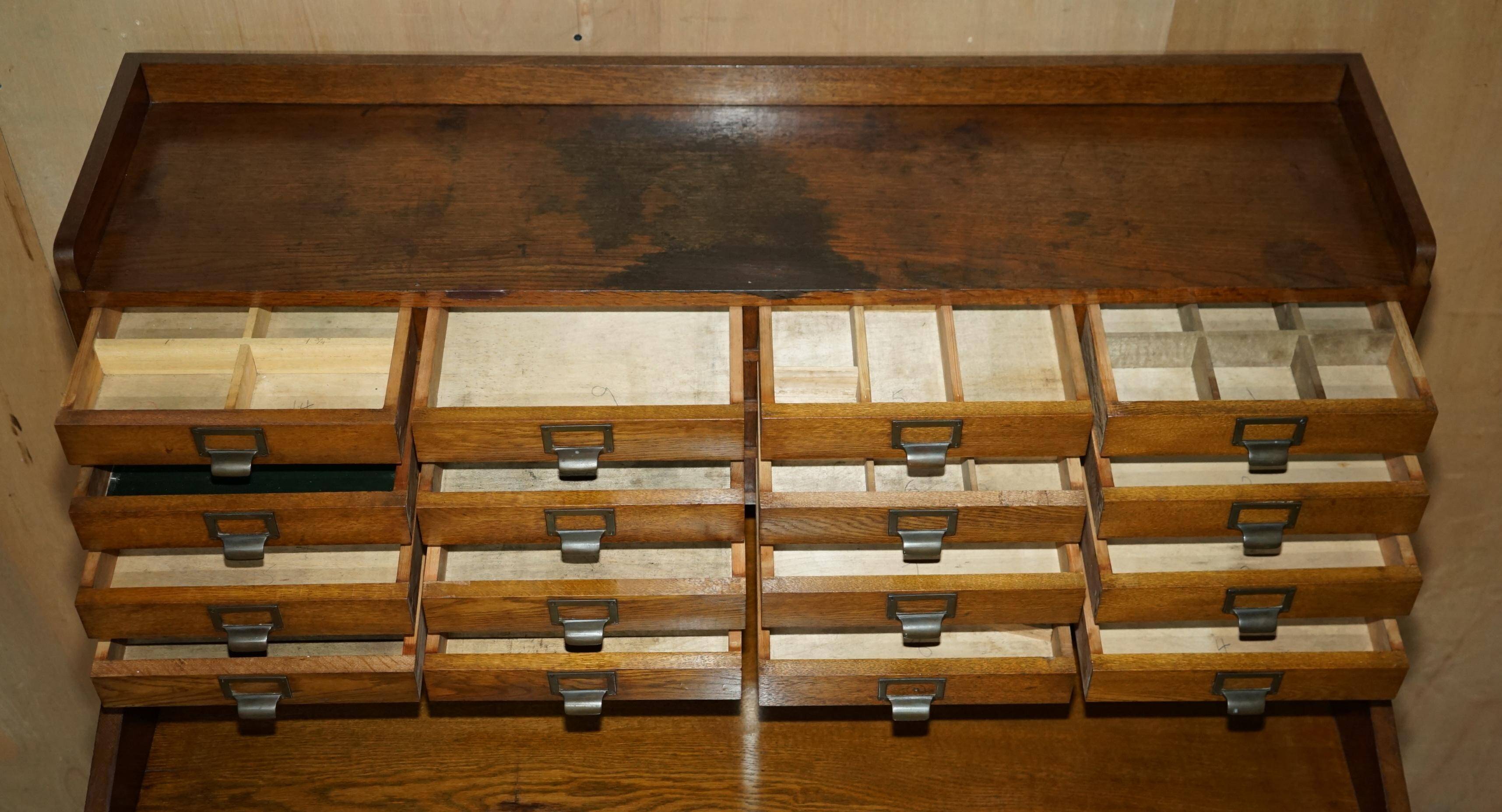 Antique English Art Deco furniture in hand-carved oak, 26 drawers.