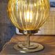 Globe table lamp in amber chiseled glass