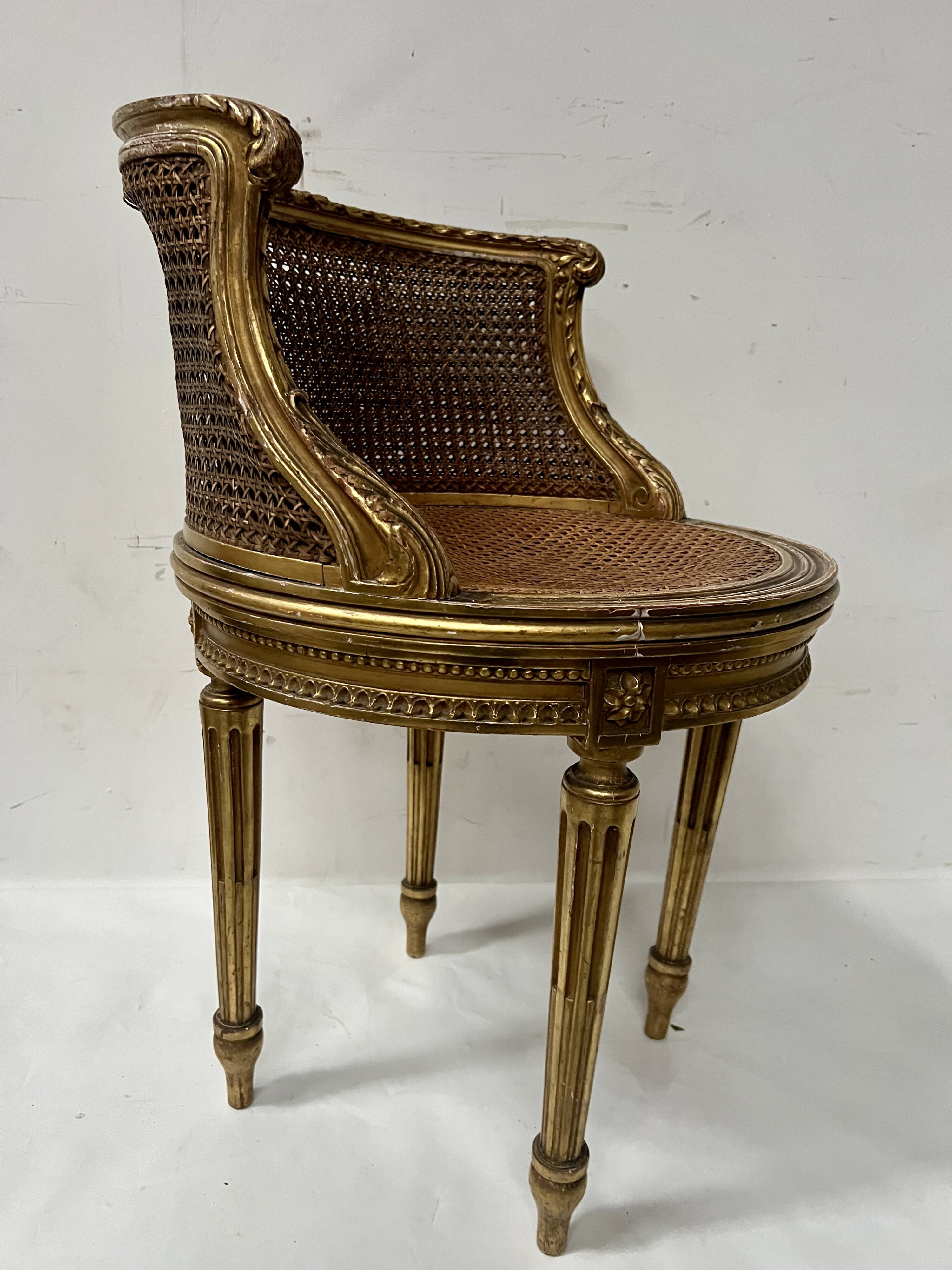 Louis XVI style armchair in wood and gilded stucco, 20th century.