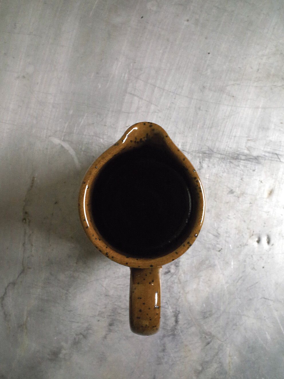 Milk pitcher in spotted sandstone