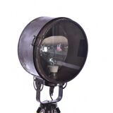 Old industrial spot on wooden tripod