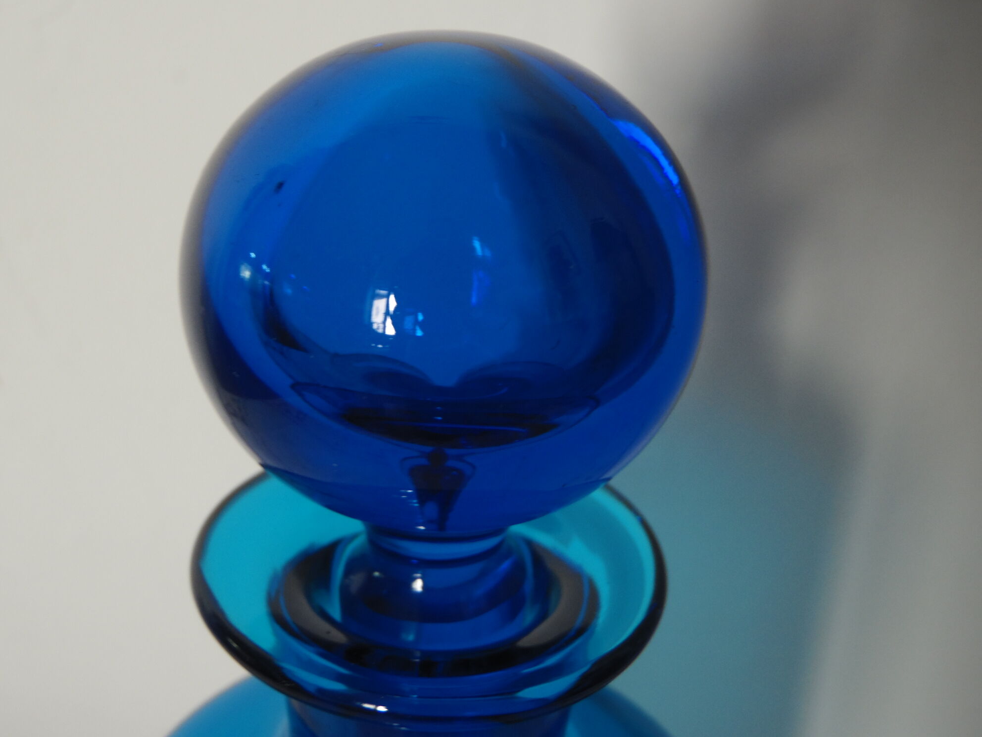 Glass bottle blue ball cap