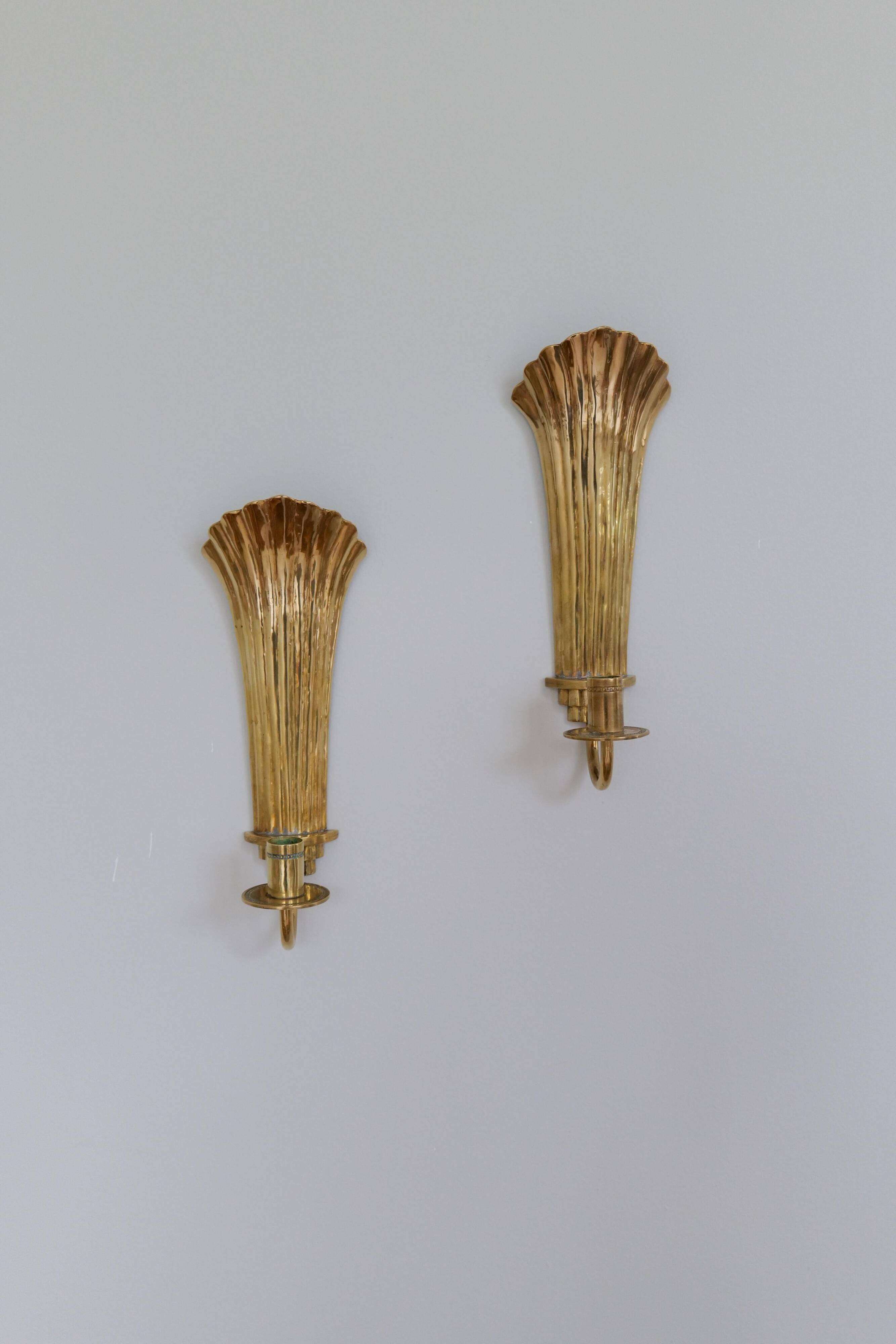 Pair of Art Deco brass wall sconces by Holmström, Arvika, Sweden, 1940s.