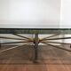 Importante table basse en acier et fer forgé patinée et dorée