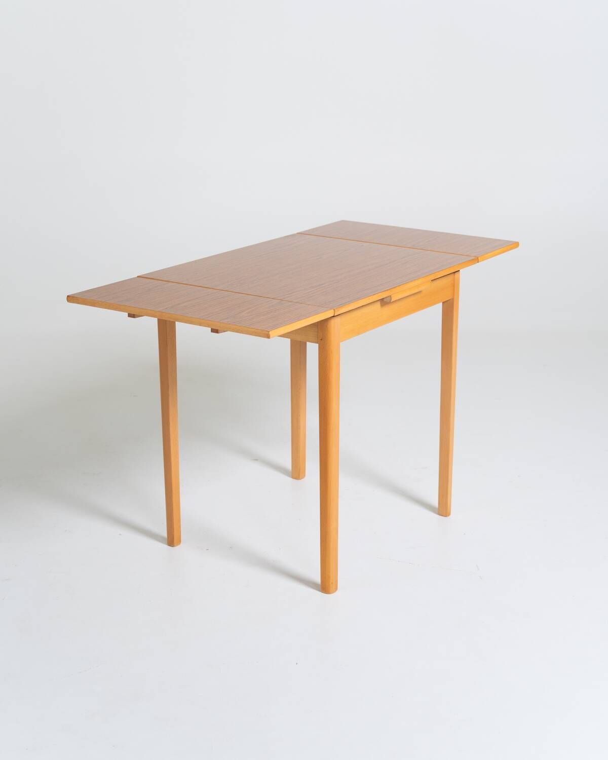 Extendable dining table in laminate and beech, Sweden, 1950s-60s