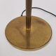 Articulated brass floor lamp