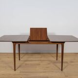 Extendable teak dining table in Mid-Century style from McIntosh, UK.