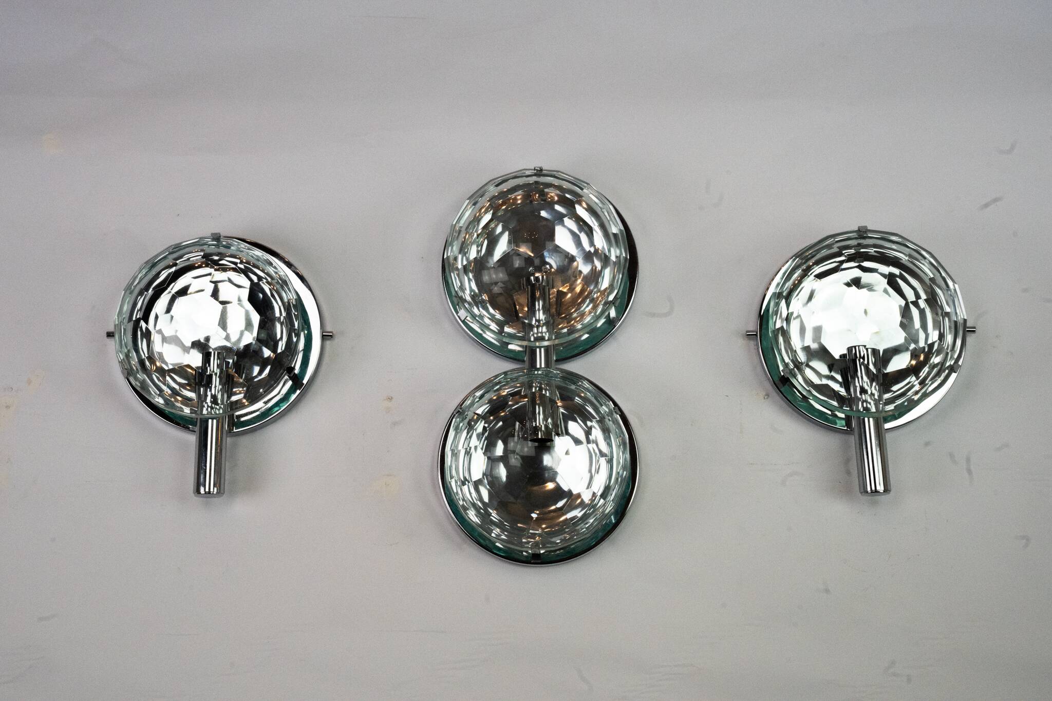 Set of three Cristal Art sconces in chrome and cut glass. Italy 1970s