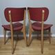 Two vintage chairs wood and mottled red vinyl