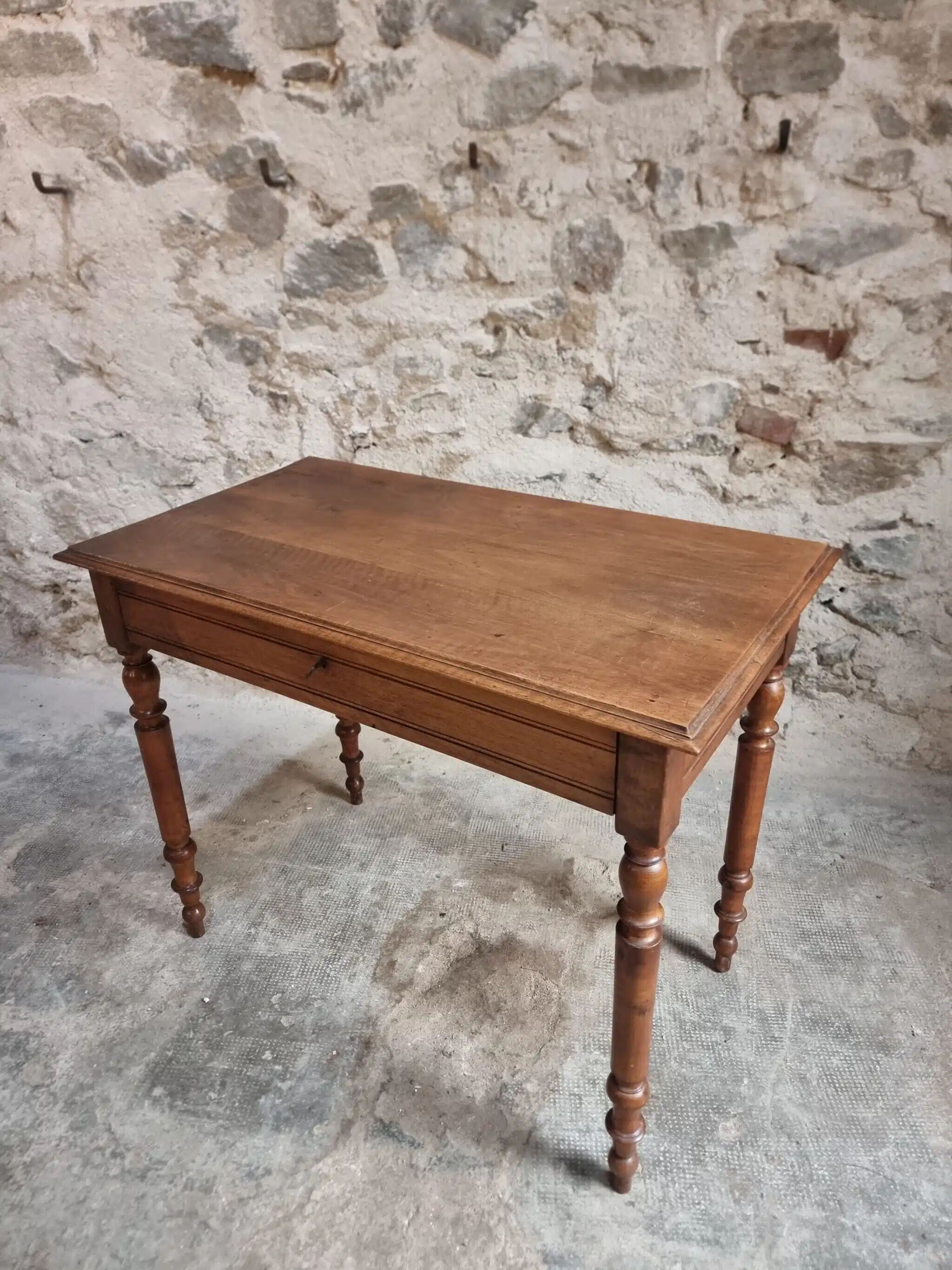 Antique French writing table in walnut with a drawer, circa 1900.