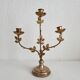 Antique bronze and brass candlestick with golden leaves