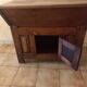 Old solid wood dough mixer carefully transformed into a bar cabinet.