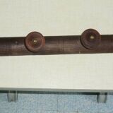 Wooden wall-mounted coat rack