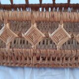 Old wicker basket with diamond-shaped decorations