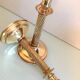 Pair of empire style brass candlesticks