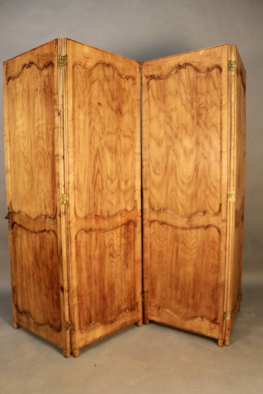 Large cherry wood folding screen with four double-sided panels.