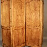 Large cherry wood folding screen with four double-sided panels.