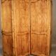 Large cherry wood folding screen with four double-sided panels.