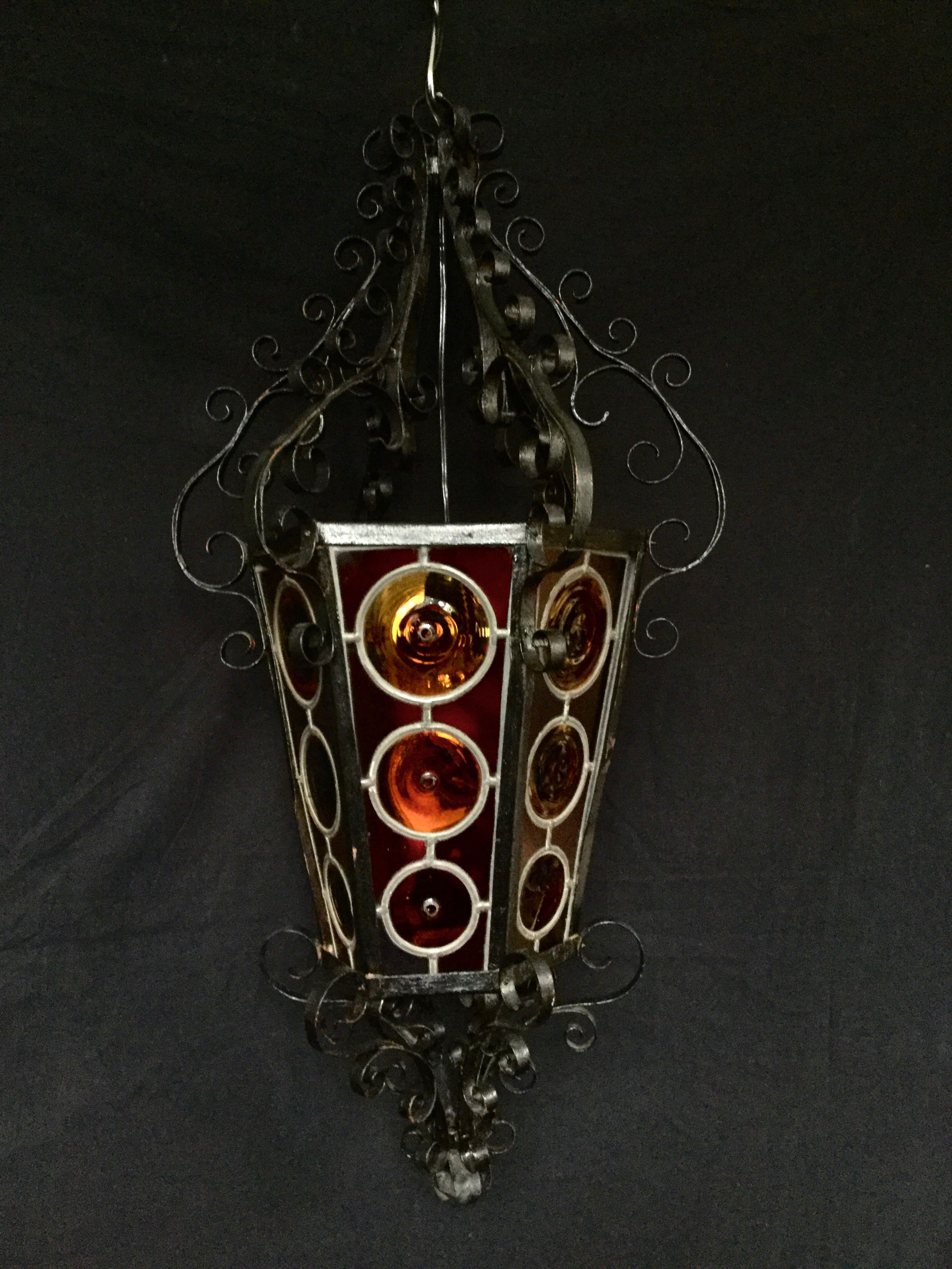 Wrought iron lantern and stained glass windows