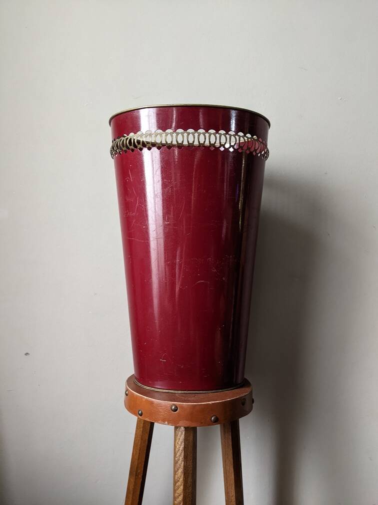 Antique metal umbrella stand with hand-painted floral decor, bohemian countryside