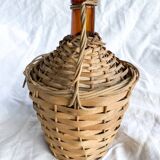 Circled with wicker demijohn