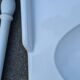 White ceramic wall washbasin with 2 ceramic legs