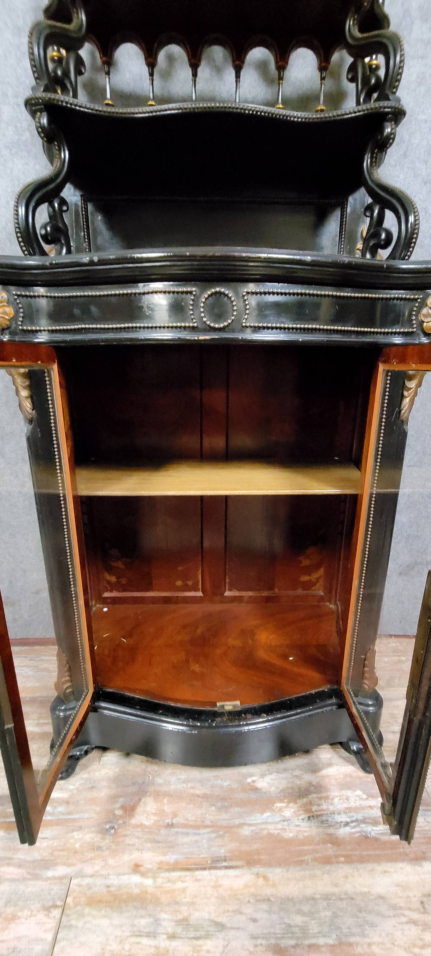 Curved "Boulle" display case from the Napoleon III period in blackened and gilded wood