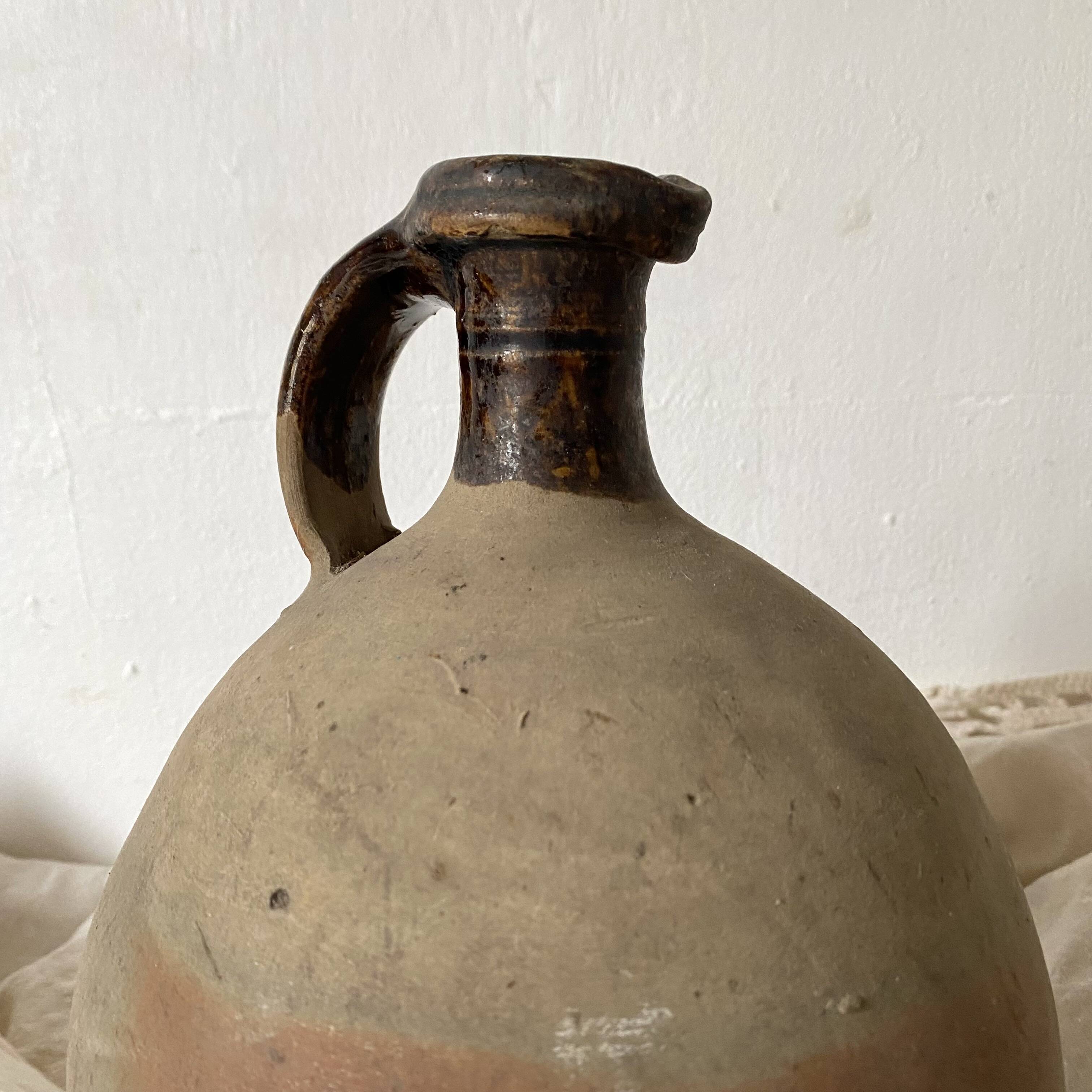 Antique jug, terracotta jar