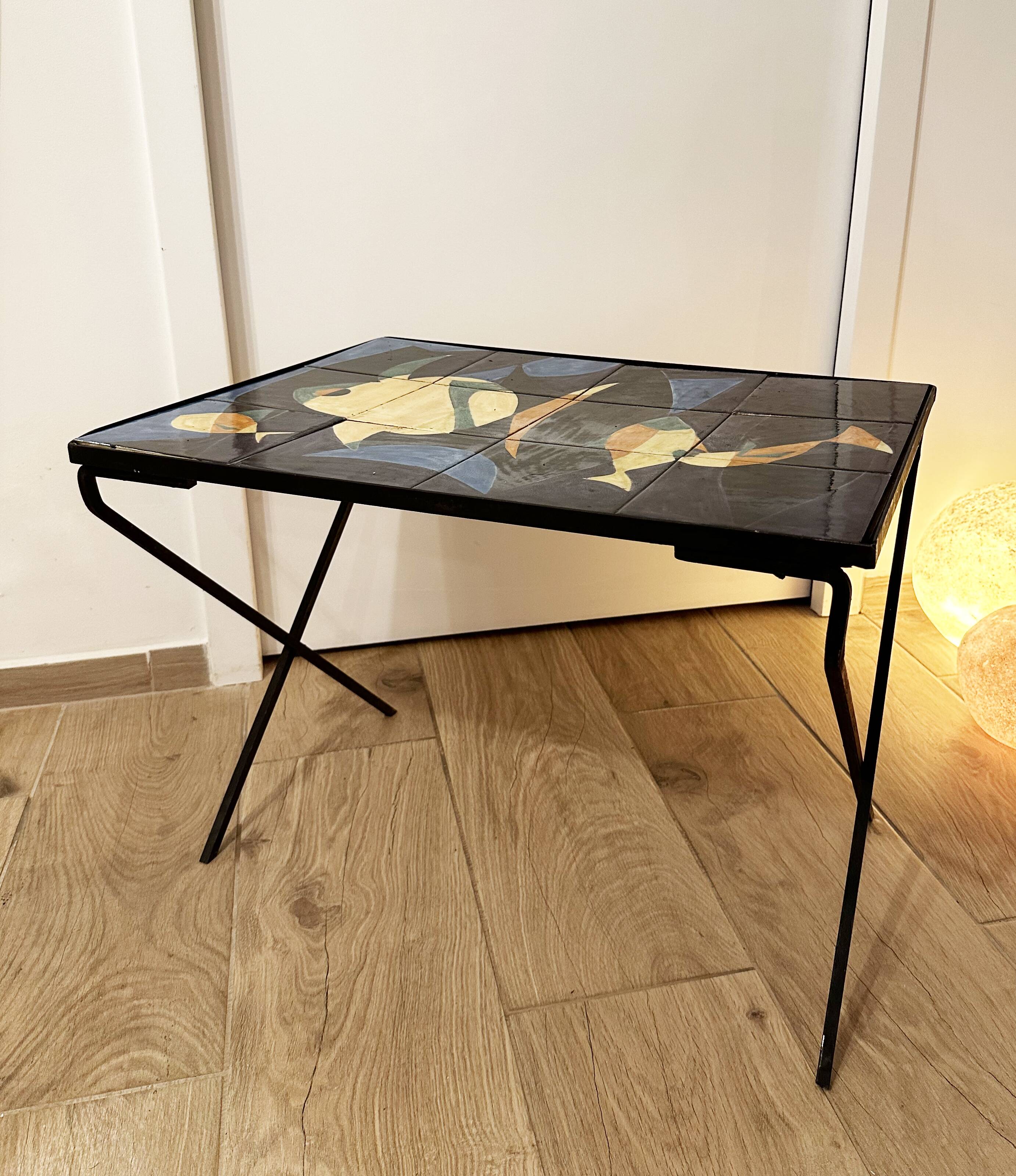 Coffee table with hand-painted ceramic top. France, 1950s
