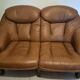 Vintage Scandinavian two-seater sofa in cognac leather and solid oak.