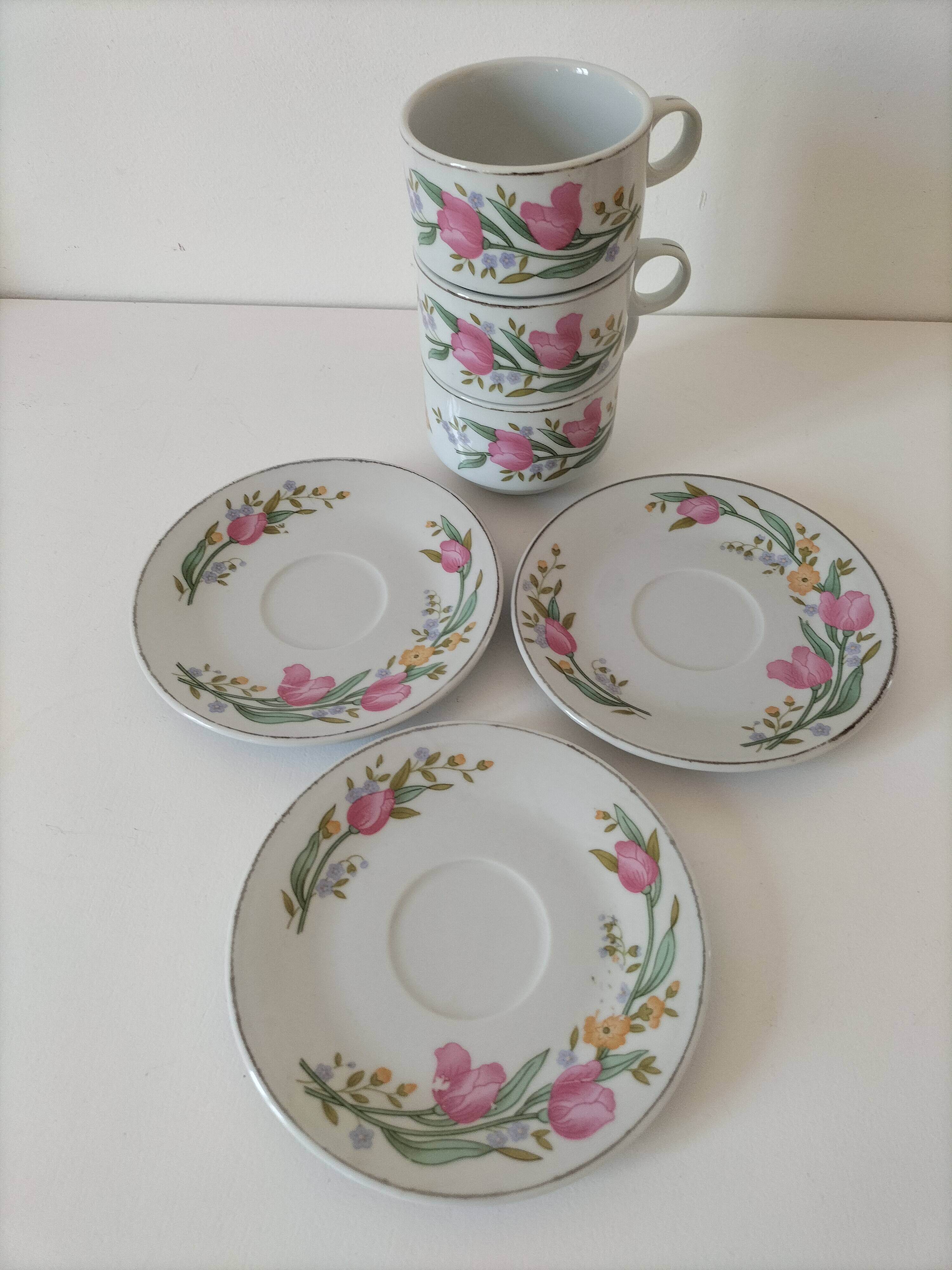 Trio of floral porcelain cups and saucers
