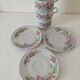 Trio of floral porcelain cups and saucers