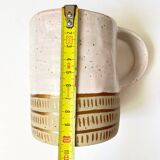 Handmade golden ceramic mug