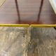 Vintage side table, brass gallery and wheels, 1950s.