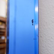 Mirror with coloured glass frame, Italy, circa 1950.
